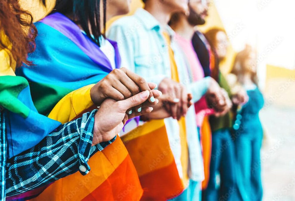 LGBTQIA+ young people holding hands