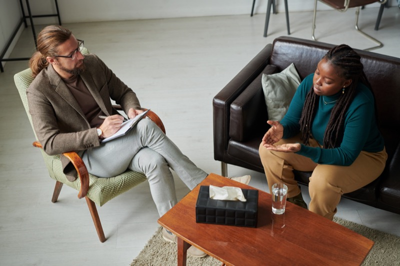 Psychotherapist talking to patient at office