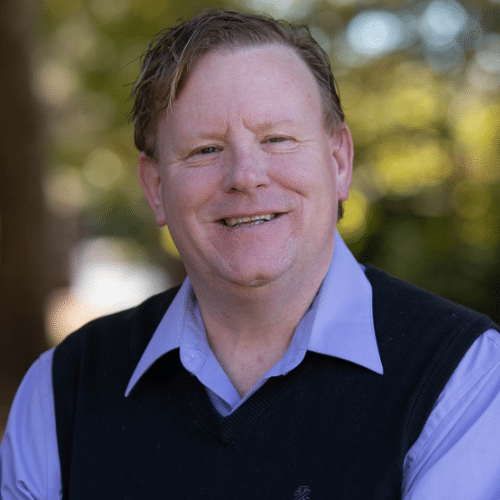 Mike Brill, Therapist at STR Behavioral Health Cedar Creek, smiling in an outdoor setting.