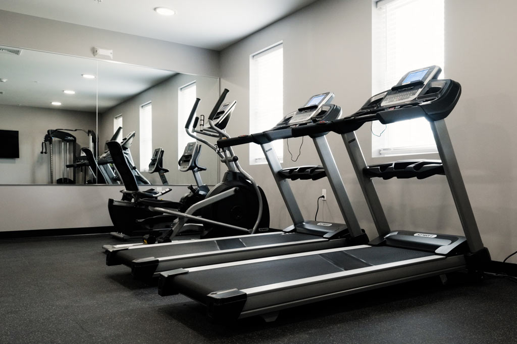 Fitness room with treadmills and elliptical machines, at Silver Pines detox and residential treatment center for addiction and mental health disorders.