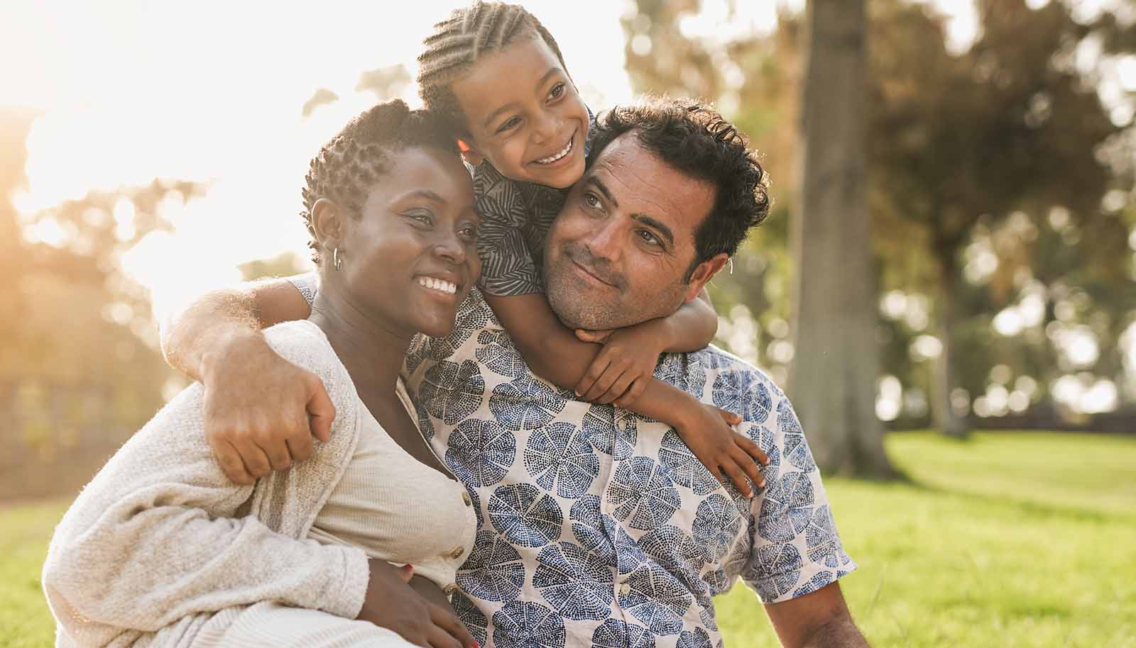 happy-family-outside-hugging