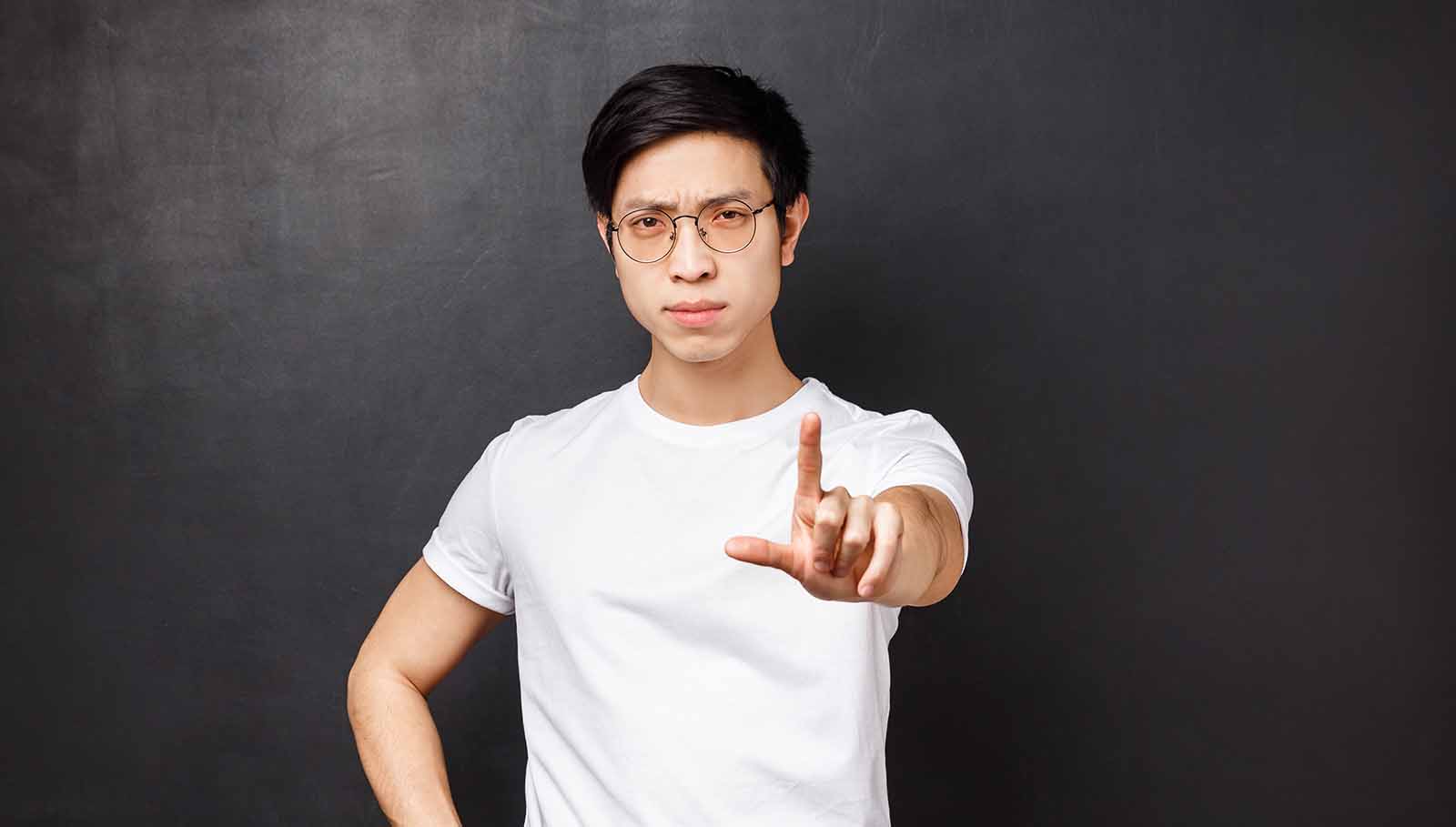 man-using-warning-hand-signal