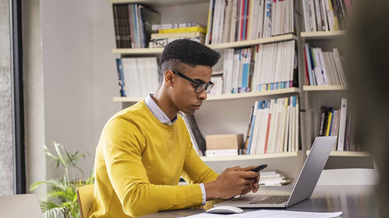 young-man-researching-on-mobile-phone